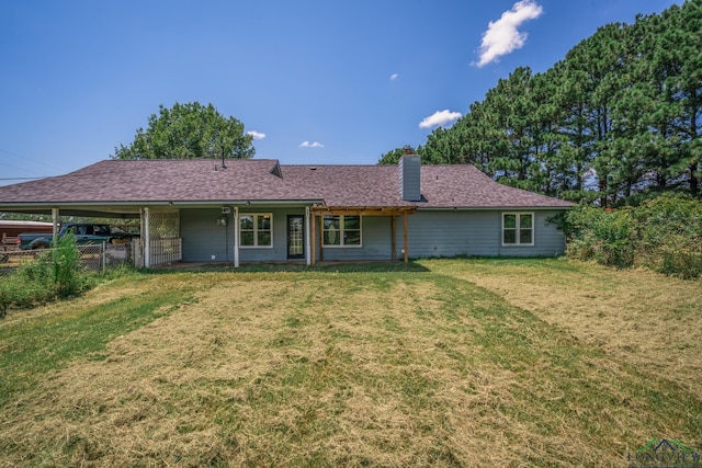 back of house with a yard