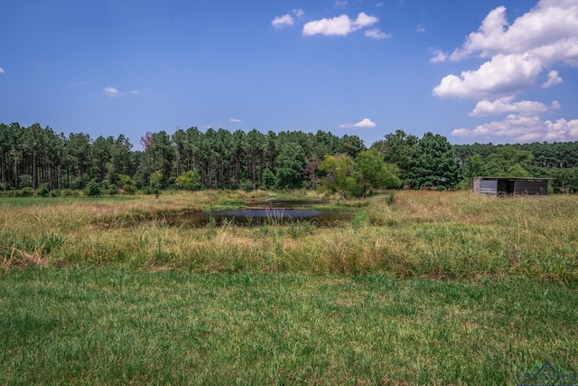 view of nature featuring a rural view and a water view