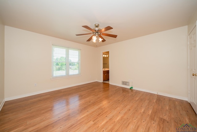 empty room with light hardwood / wood-style flooring and ceiling fan