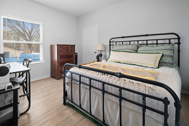 bedroom with light hardwood / wood-style flooring