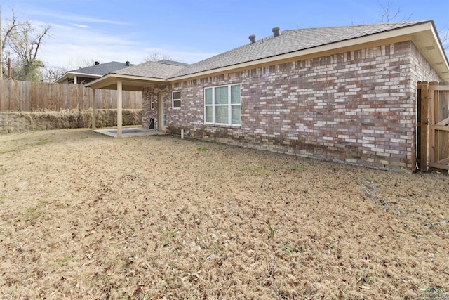 back of property with a patio area