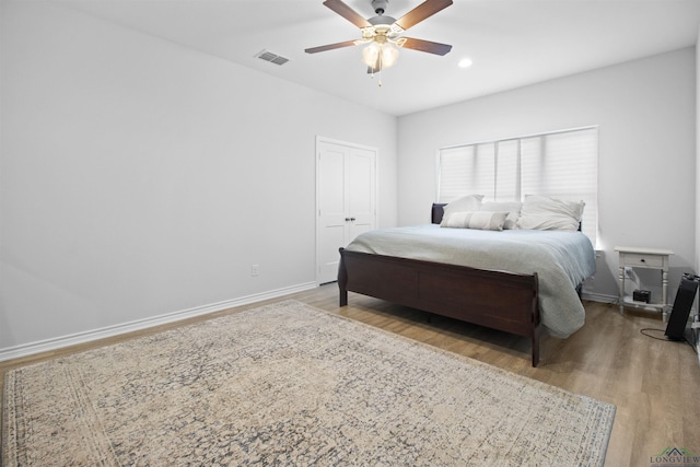 bedroom featuring ceiling fan and light wood-type flooring