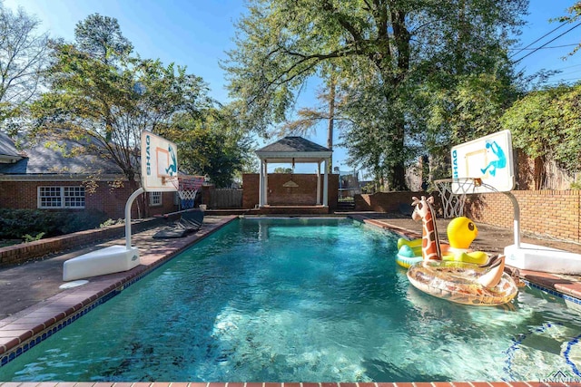 view of swimming pool featuring a gazebo