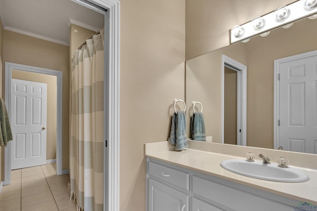 bathroom with tile patterned flooring, vanity, and ornamental molding