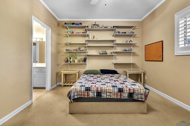 carpeted bedroom featuring connected bathroom, ceiling fan, and crown molding