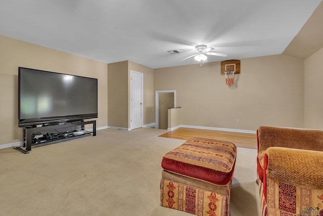 living room with carpet and ceiling fan