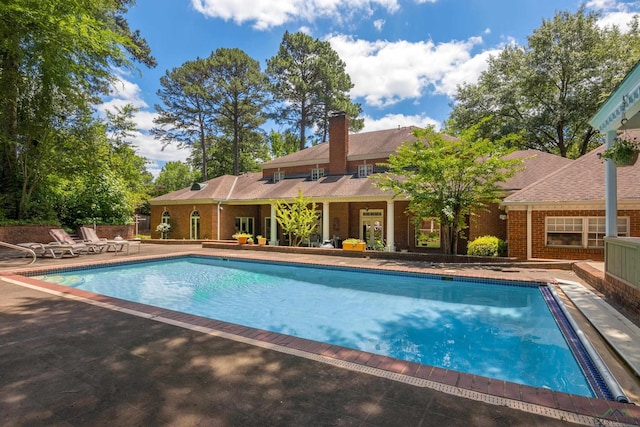 view of swimming pool with a patio