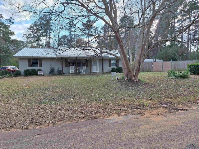 ranch-style house with a front lawn