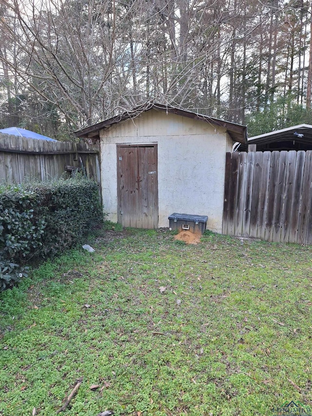 view of outdoor structure with a lawn