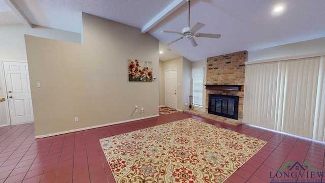 tiled living room with a brick fireplace, a textured ceiling, lofted ceiling with beams, and ceiling fan