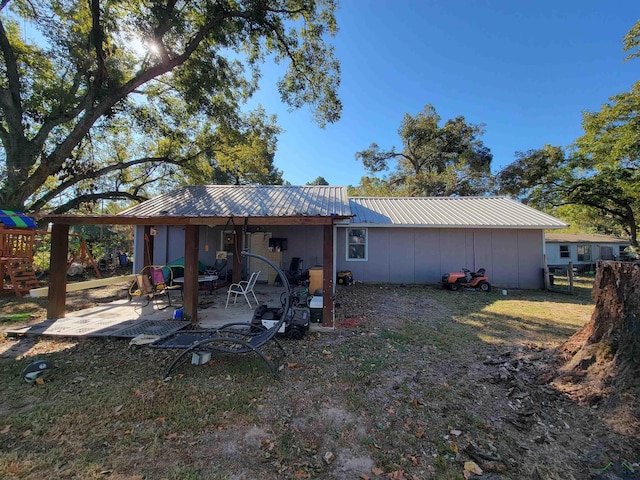 rear view of house featuring a patio area