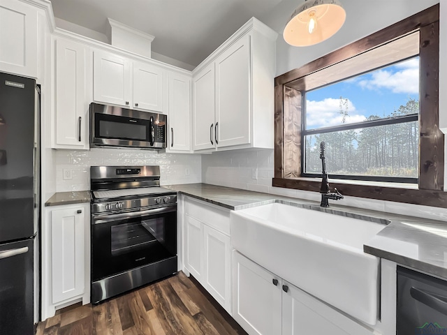 kitchen featuring stainless steel appliances and white cabinets