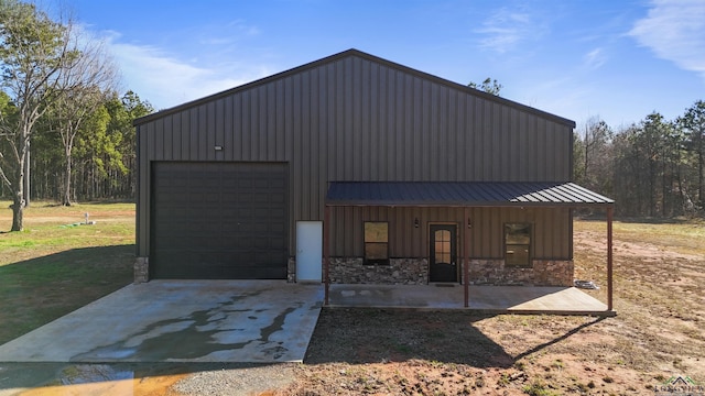 view of front facade featuring a garage and an outdoor structure