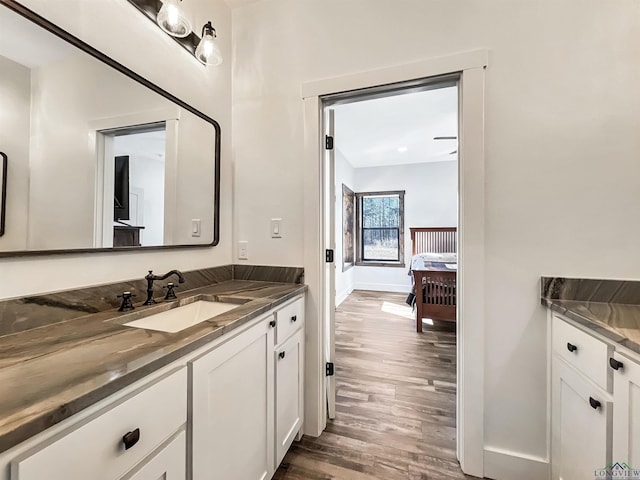 bathroom featuring vanity and hardwood / wood-style floors