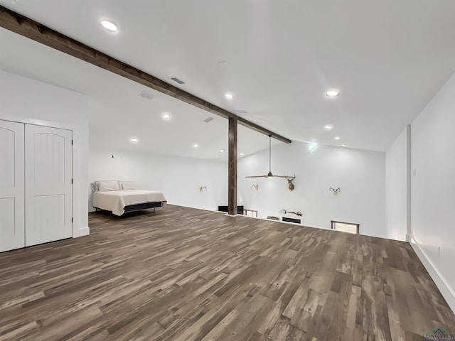 interior space with vaulted ceiling with beams and hardwood / wood-style floors