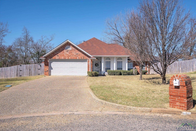 ranch-style house featuring driveway, an attached garage, fence, a front yard, and brick siding