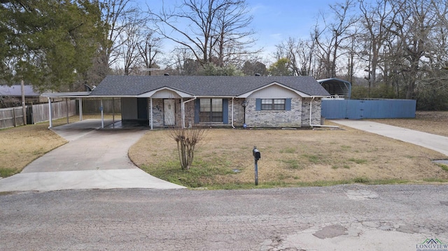 ranch-style house with roof with shingles, driveway, a front lawn, and fence