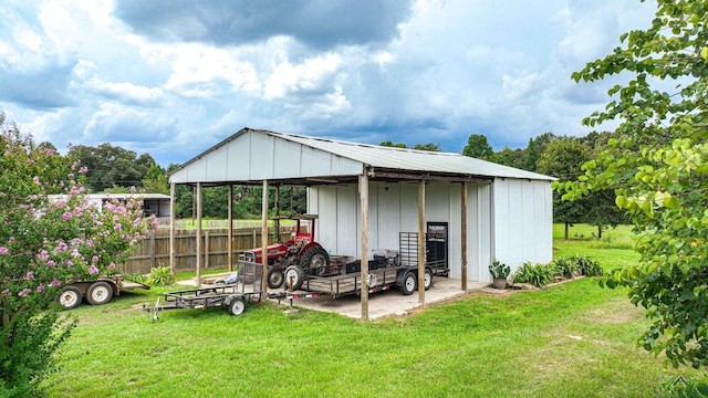 view of outbuilding with a lawn