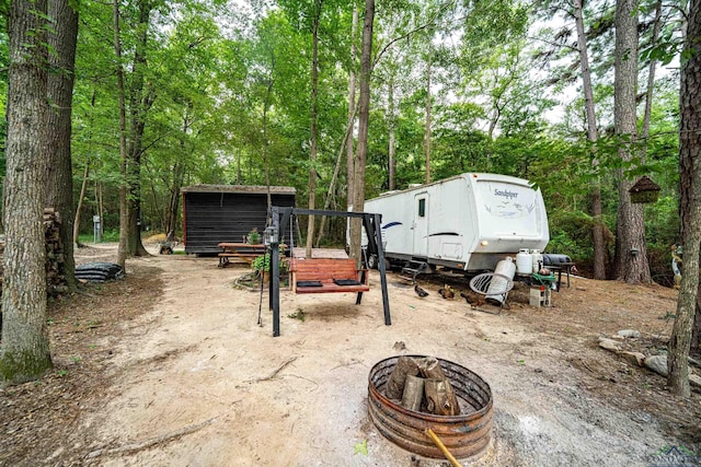 view of patio / terrace with a fire pit