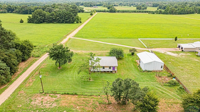 birds eye view of property with a rural view