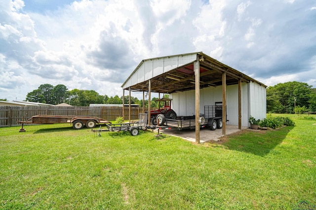 exterior space with a lawn and an outbuilding