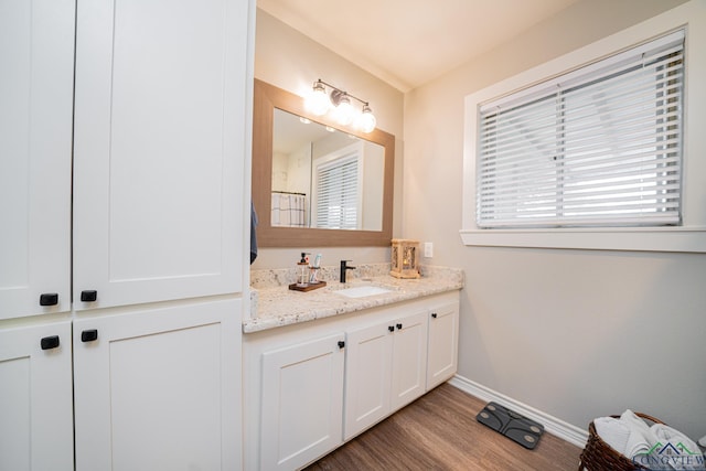 bathroom featuring vanity and hardwood / wood-style flooring