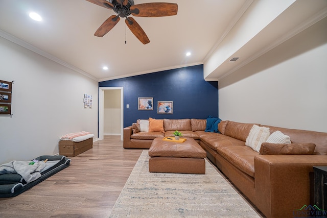 living room with crown molding, light hardwood / wood-style floors, and ceiling fan