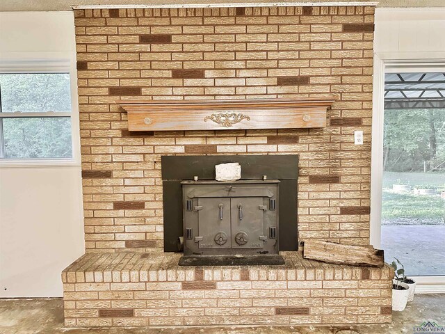 room details featuring a brick fireplace