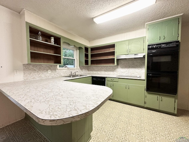kitchen with a peninsula, dobule oven black, open shelves, and green cabinetry