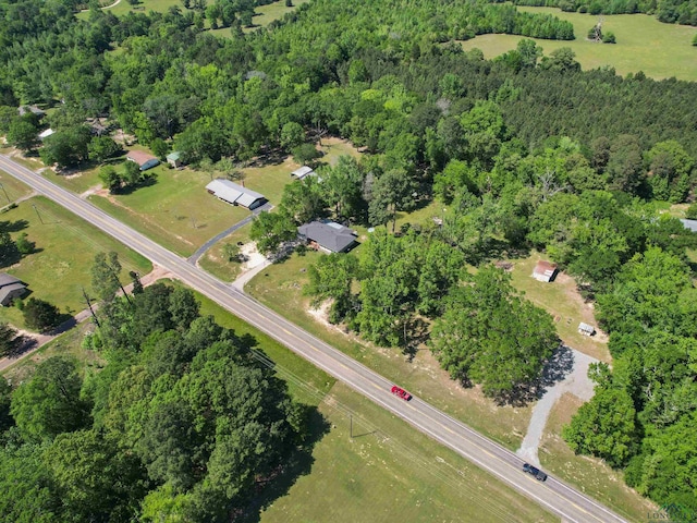 drone / aerial view with a view of trees