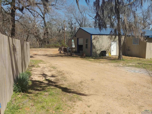 view of outdoor structure featuring fence