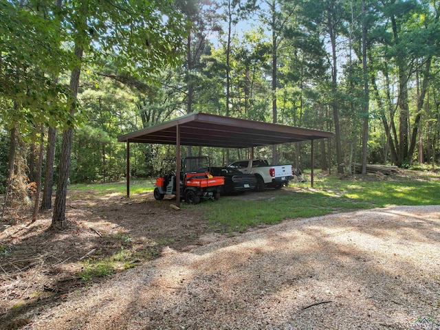 view of vehicle parking with a carport