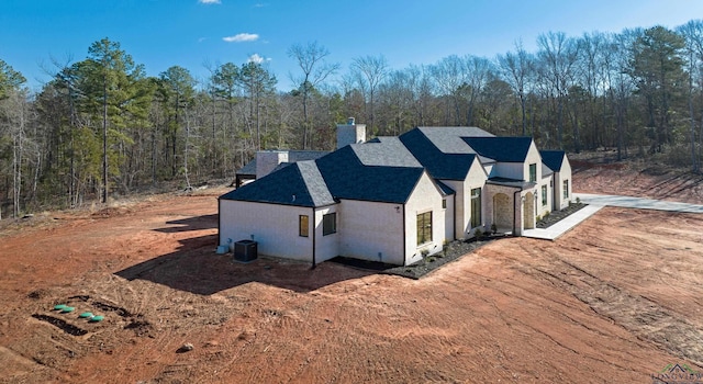 view of property exterior with central AC