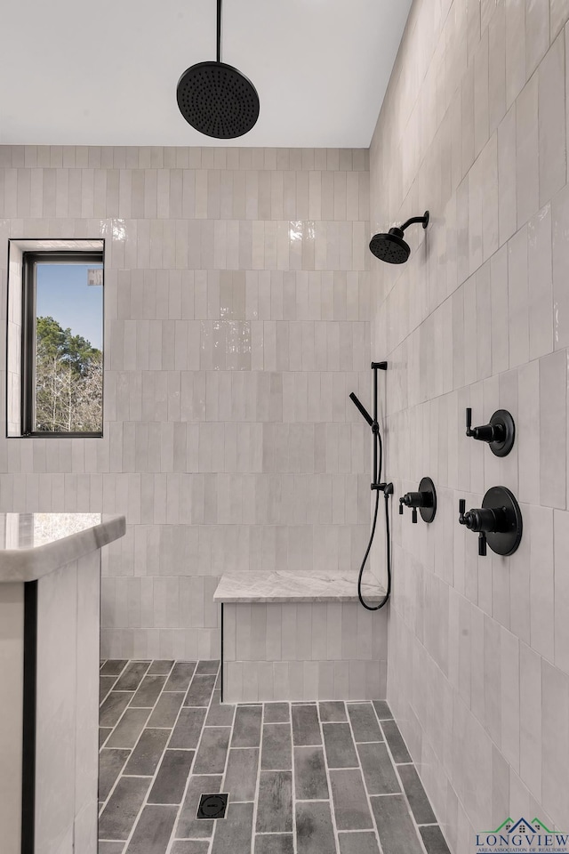 bathroom featuring tiled shower