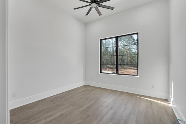 unfurnished room featuring ceiling fan and light hardwood / wood-style flooring