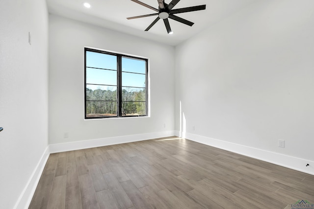 empty room featuring ceiling fan and light hardwood / wood-style floors