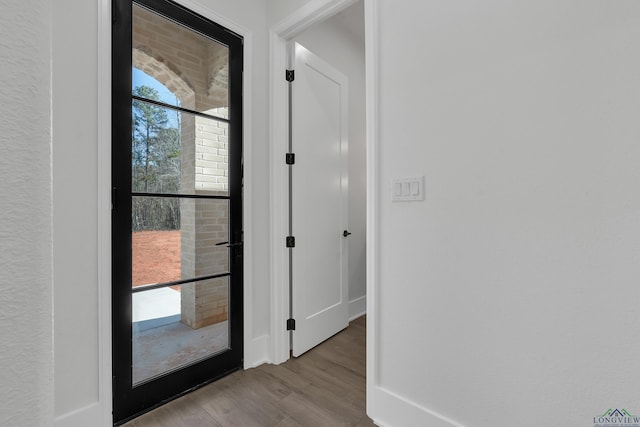 entryway with light hardwood / wood-style floors