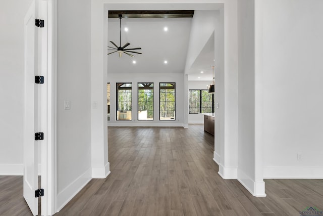 corridor with hardwood / wood-style flooring