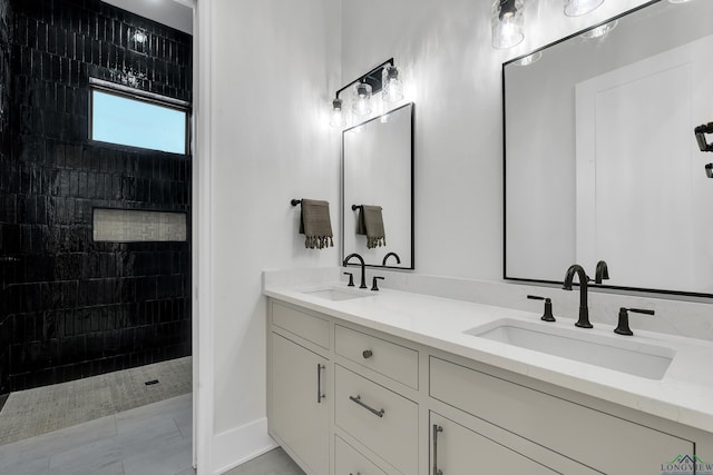 bathroom featuring vanity and a tile shower