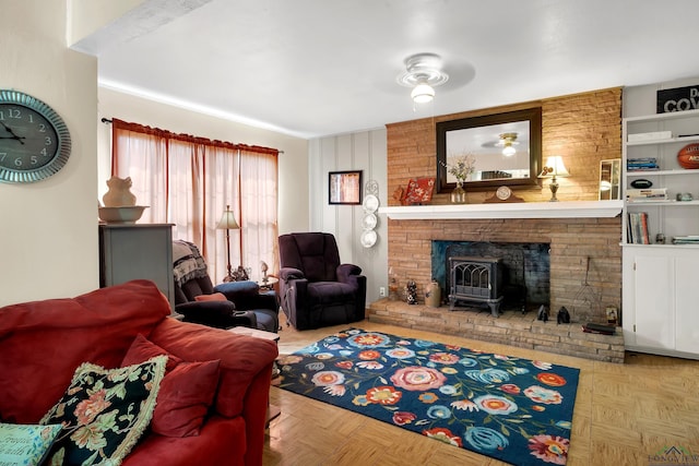 living room with built in features, light parquet flooring, and a wood stove