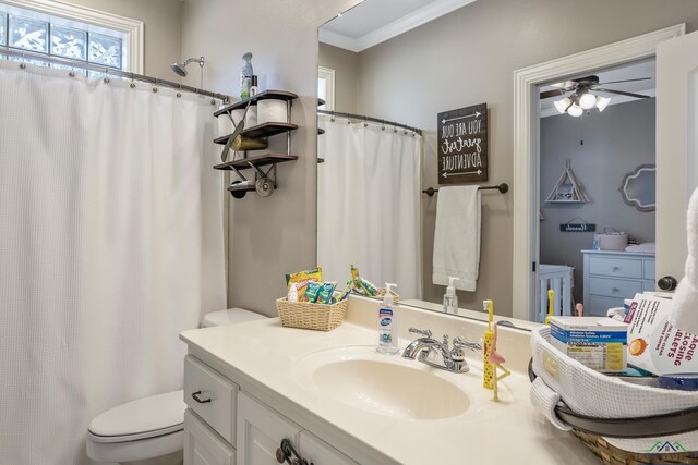 15579 County Road 1104, Flint, TX 75762 - bathroom featuring toilet, a ceiling fan, vanity, crown molding, and curtained shower