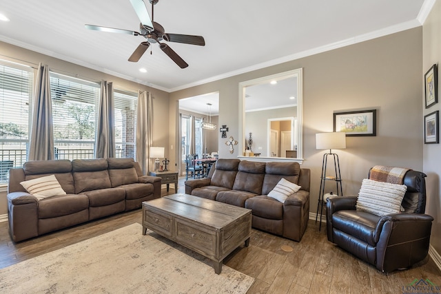 15579 County Road 1104, Flint, TX 75762 - living room with wood finished floors, a ceiling fan, baseboards, ornamental molding, and recessed lighting