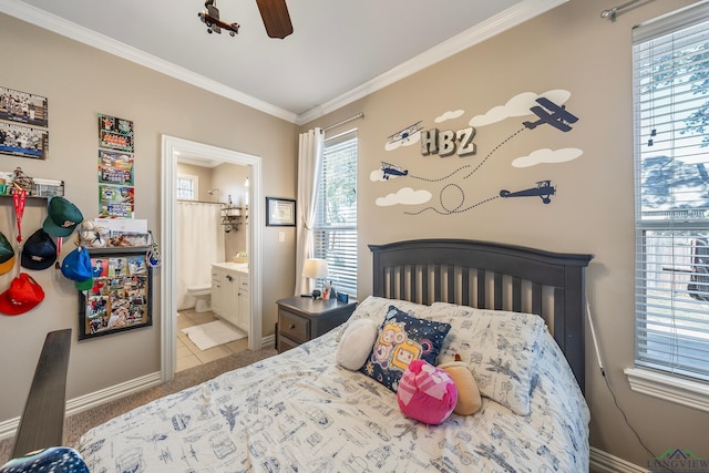 15579 County Road 1104, Flint, TX 75762 - bedroom with baseboards, crown molding, ensuite bathroom, a ceiling fan, and light tile patterned flooring