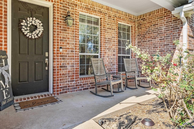 15579 County Road 1104, Flint, TX 75762 - view of exterior entry with a porch and brick siding