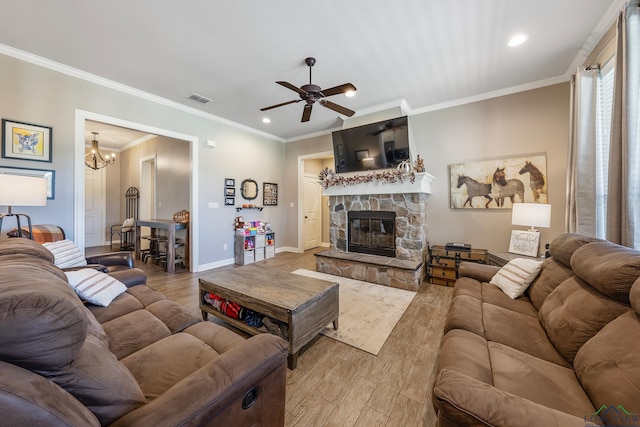 15579 County Road 1104, Flint, TX 75762 - living area with wood finished floors, a ceiling fan, ornamental molding, recessed lighting, and a stone fireplace