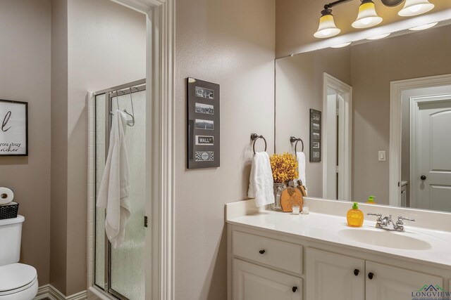15579 County Road 1104, Flint, TX 75762 - bathroom with toilet, a stall shower, and vanity