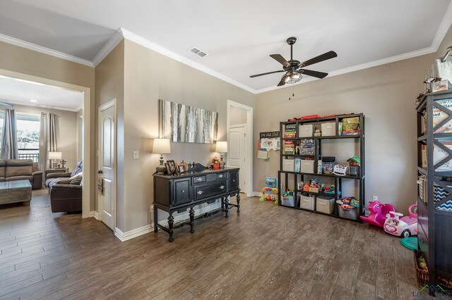 15579 County Road 1104, Flint, TX 75762 - living area with a ceiling fan, wood finished floors, ornamental molding, and baseboards
