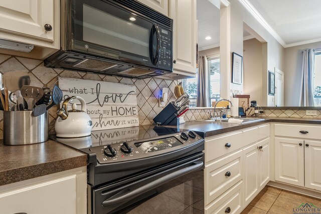 15579 County Road 1104, Flint, TX 75762 - kitchen with black appliances, a sink, ornamental molding, backsplash, and dark countertops