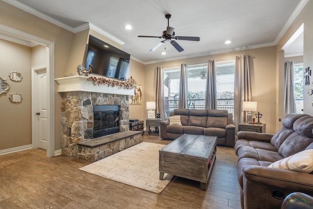 15579 County Road 1104, Flint, TX 75762 - living area with ceiling fan, hardwood / wood-style floors, a fireplace, ornamental molding, and recessed lighting