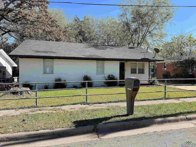 ranch-style house with a front yard